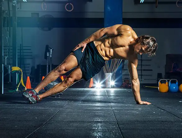 A man doing a plank on the ground