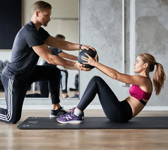 A man and woman are working out together.