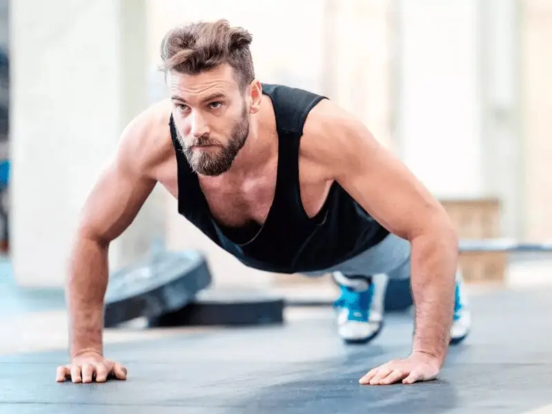 A man is doing push ups on the floor