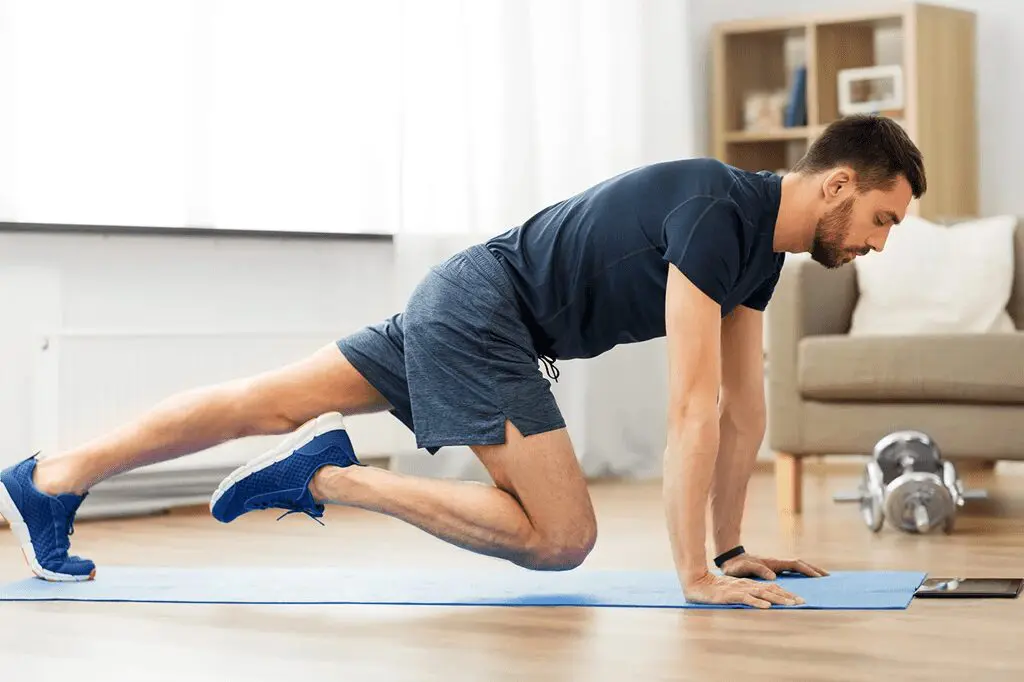 A man is doing a plank on the floor