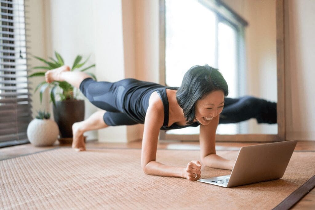 A woman is doing yoga on the floor