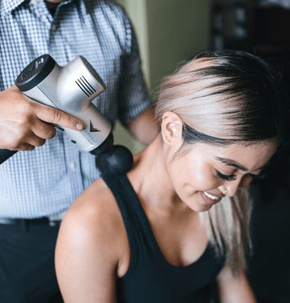 A woman getting her hair done by a stylist.